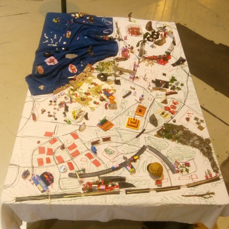 An image of a model of Tampere made with plants, materials and waste